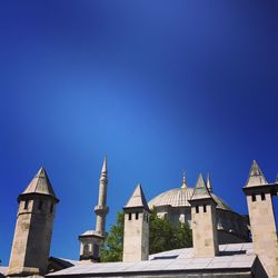 Low angle view of built structure against clear blue sky