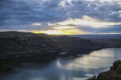 Scenic view of mountains against sky during sunset