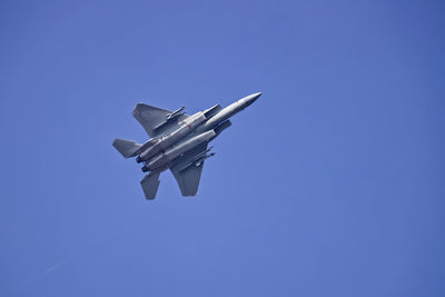 Low angle view of airplane flying in sky