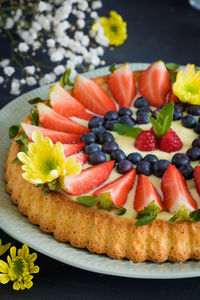 Close-up of fruits on tart in plate