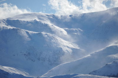 The tarcul mountains, viev from the muntele mic mountain, winter scene with snowcaped mountains