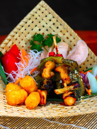 High angle view of fruits in basket on table