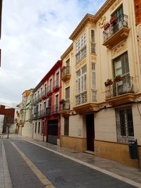 Residential buildings by street in city