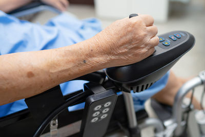 Close-up of person holding bicycle