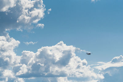 Low angle view of airplane flying in sky