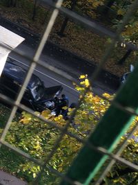 High angle view of people walking on road in city