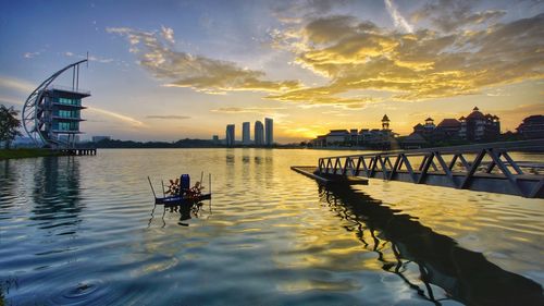 Scenic view of river against sky during sunset