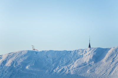 Scenic view of snowcapped mountains against clear sky