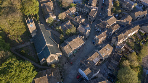 High angle view of trees and buildings in city