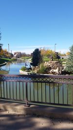 Calm river with buildings in background