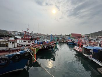 Boats moored at harbor