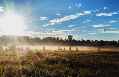 Panoramic view of field against sky