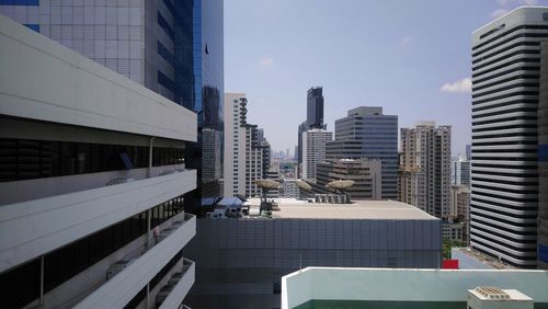 Modern buildings in city against sky