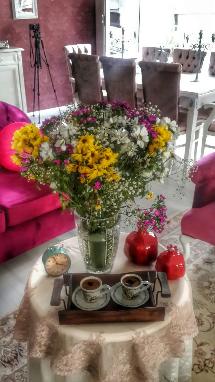 flower, freshness, indoors, vase, table, fragility, petal, flower arrangement, bouquet, potted plant, home interior, variation, flower pot, flower head, red, decoration, bunch of flowers, glass - material, restaurant, drinking glass