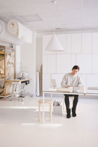 Full length of man working at table