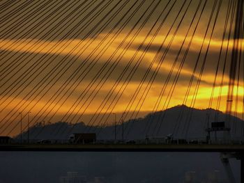 Scenic view of silhouette mountains against sky at sunset