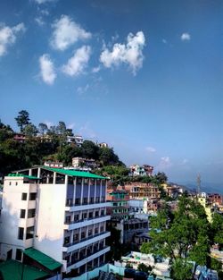 High angle view of townscape against blue sky