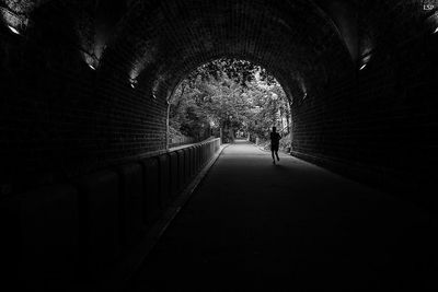 People walking in tunnel