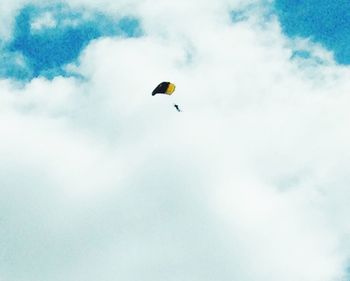 Low angle view of parachute against sky