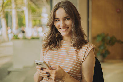 Young woman using mobile phone