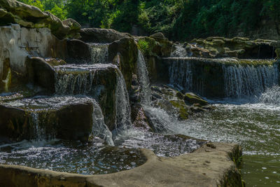 Water flowing over rocks by sea