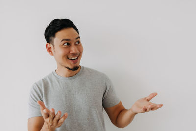 Portrait of young man against white background