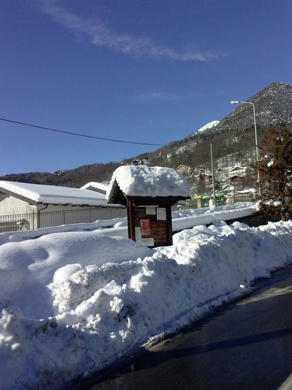 snow, winter, cold temperature, season, weather, covering, white color, frozen, snowcapped mountain, sky, landscape, mountain, covered, snow covered, transportation, nature, house, building exterior, built structure, tranquil scene