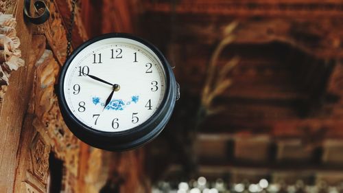 Close-up of clock on wall