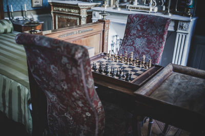 High angle view of old chessboard on table