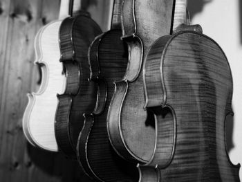 Close-up of guitars hanging indoors