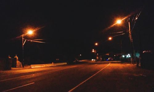 Illuminated street light at night