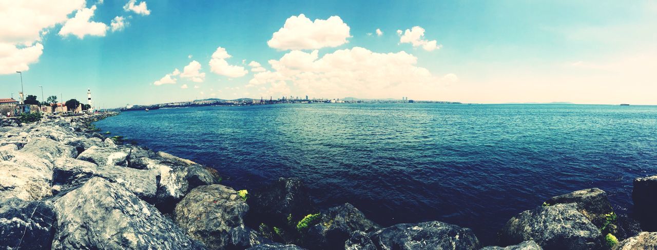 sea, water, sky, horizon over water, scenics, beauty in nature, tranquil scene, rock - object, tranquility, nature, cloud - sky, beach, blue, rock formation, idyllic, shore, cloud, day, cliff, rock