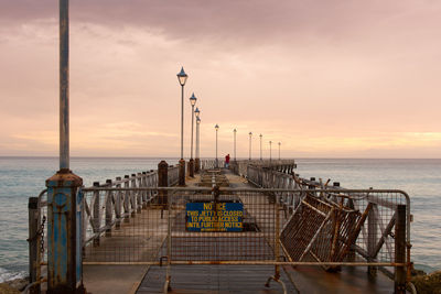 Old closed pier during sunset