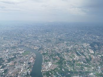 Aerial view of cityscape against sky