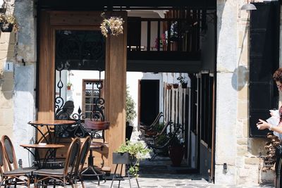 Chairs and tables against building