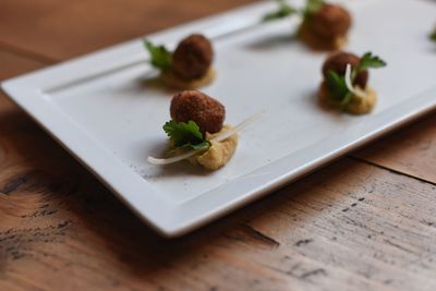 High angle view of vegetables in plate on table