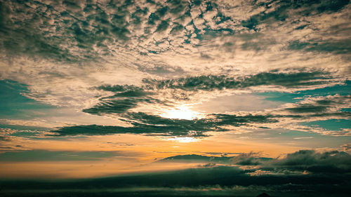 Low angle view of dramatic sky during sunset