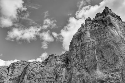 Low angle view of rock formation against sky