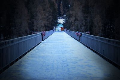 Footbridge in winter at night