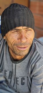 Midsection of man wearing hat