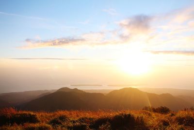 Scenic view of mountains against sky during sunset