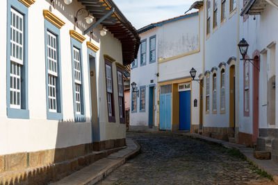 Alley amidst buildings in city