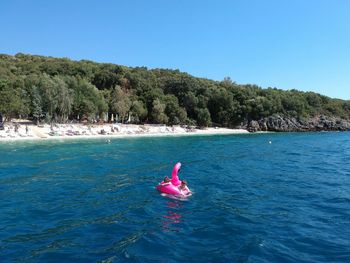 Scenic view of sea against clear blue sky