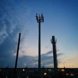 Low angle view of silhouette built structure against sky