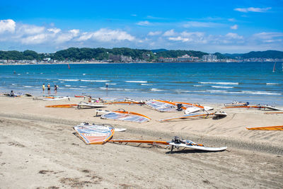 High angle view of boats moored on beach against sky