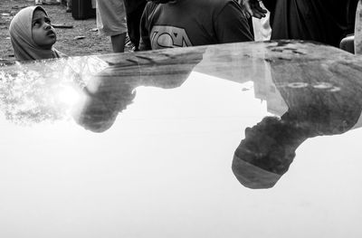 Reflection of people on water