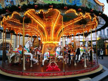 Illuminated carousel in amusement park