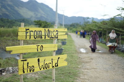 Gampong nusa sign and montain view