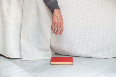 High angle view of woman relaxing on bed