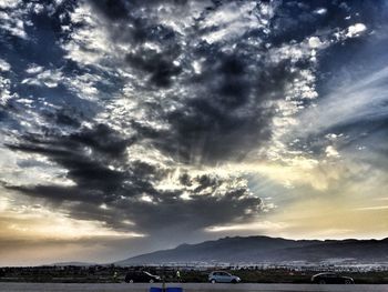 Scenic view of sea against dramatic sky